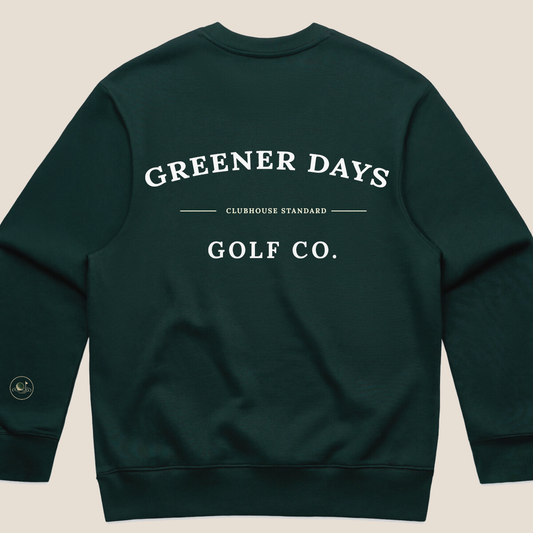 Dark green crewneck sweatshirt with large back print reading "Greener Days Golf Co. – Clubhouse Standard
