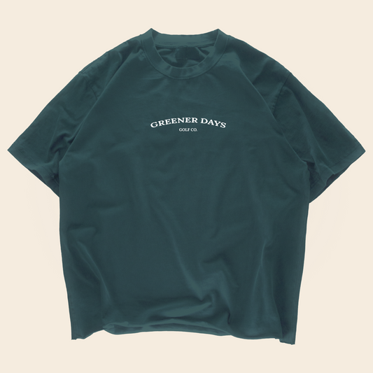 Dark green oversized Greener Days Golf Co. t-shirt with minimalist white logo on front, streetwear style casual golf apparel